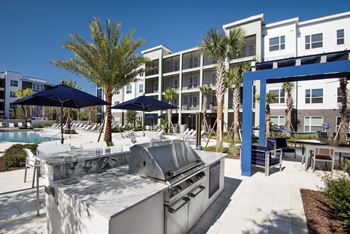 Bbq grills and outdoor dining areas at each building